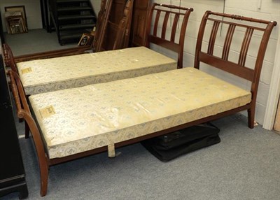 Lot 1122 - A pair of mahogany single bed frames, with bed bases (2)