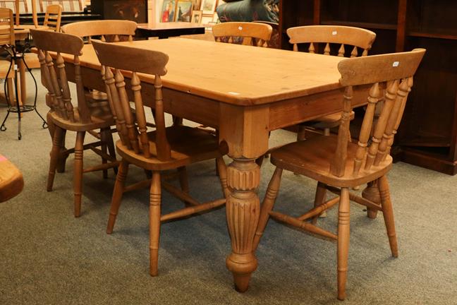 Lot 1135 - A modern pine farmhouse dining table, 183cm by 122cm by 77cm and six similar chairs