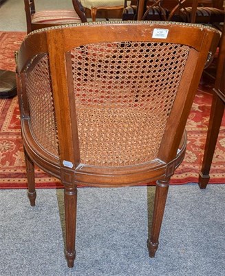 Lot 1138 - A pair of Louis XVI style caned tub chairs, with loose leather squabs Provenance: Ex Lot 548...