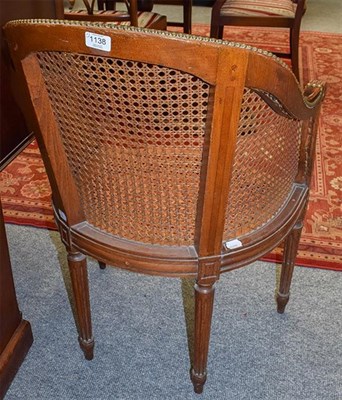 Lot 1138 - A pair of Louis XVI style caned tub chairs, with loose leather squabs Provenance: Ex Lot 548...