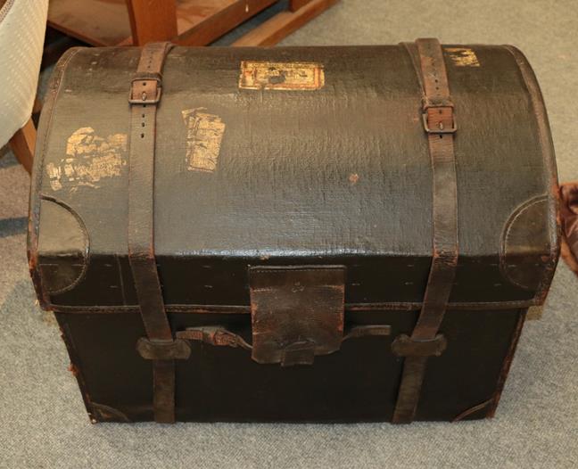 Lot 1143 - A 19th century dome top canvas and leather bound trunk with straps, 78cm by 55cm by 62cm