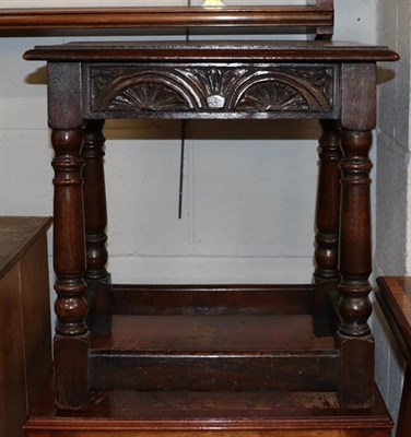 Lot 1157 - An Edwardian mahogany inlaid fold over bridge table, together with a modern oak three shelf...