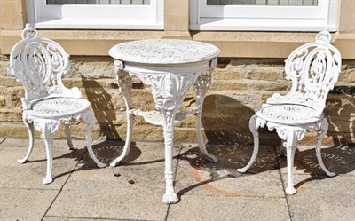 Lot 1160 - A Victorian style white painted metal garden table, together with a pair of matching chairs (3)