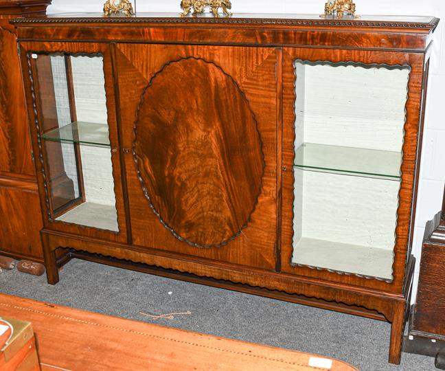 Lot 1168 - An Edwardian glazed mahogany display case, 183cm by 40cm by 137cm