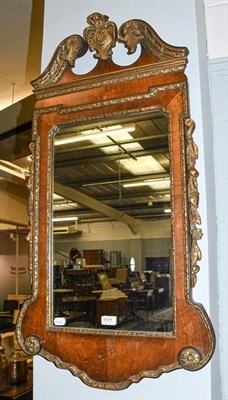 Lot 1171 - A Georgian style reproduction parcel gilt walnut pier glass, 55cm by 100cm