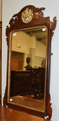 Lot 1174 - A George III mahogany and parcel gilt fret work wall mirror, 57cm by 107cm