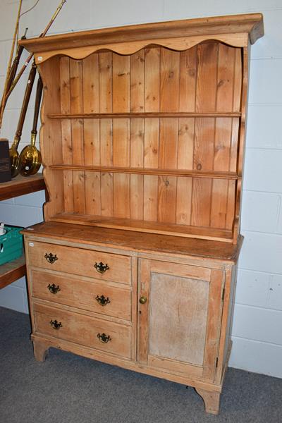 Lot 1180 - An early 20th century pine farmhouse kitchen dresser, 121cm by 43cm by 196cm