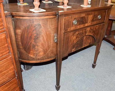 Lot 1195 - A George III style mahogany breakfront sideboard, two central drawers flanked by twin cupboard...