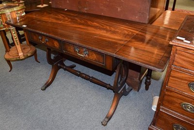 Lot 1202 - A Reproduction mahogany sofa table, 142cm (open) by 56cm by 73cm high, together with an...