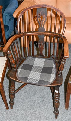 Lot 1224 - A 19th century yew Windsor chair with crinoline stretcher