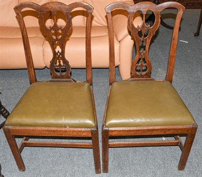 Lot 1225 - A pair of Georgian oak dining chairs with drop-in seats