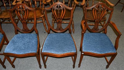 Lot 1231 - A set of six Hepplewhite style mahogany dining chairs
