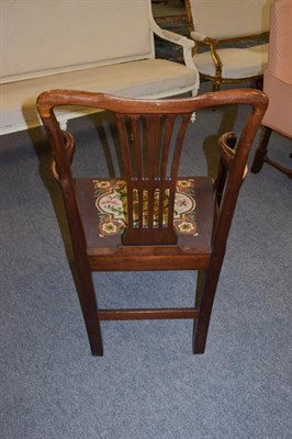 Lot 1234 - A mahogany open armchair with drop in needlework seat, with square section legs joined by a...