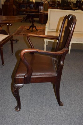 Lot 1234 - A mahogany open armchair with drop in needlework seat, with square section legs joined by a...