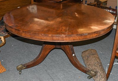 Lot 1240 - A Regency crossbanded mahogany circular top breakfast table, raised on a turned pedestal with...
