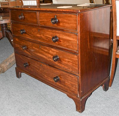 Lot 1243 - A George III mahogany four height straight front chest of drawers with later handles, 112cm by 54cm