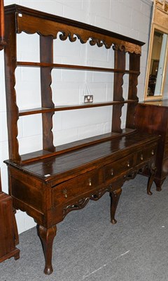 Lot 1247 - An 18th century oak dresser base with an associated rack of similar date, 181cm by 50cm, the...