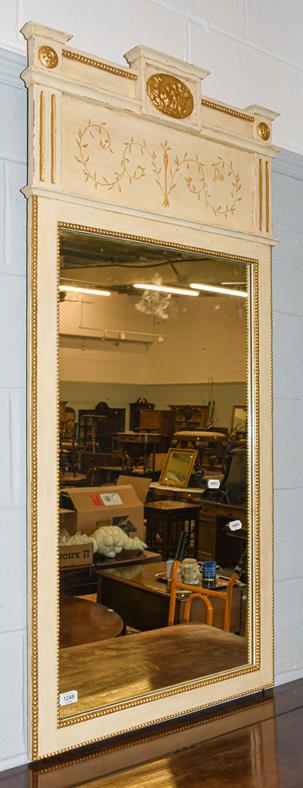 Lot 1248 - A painted parcel gilt hall mirror, 66cm by 141cm