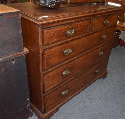 Lot 1267 - A George III crossbanded oak four height straight front chest of drawers, 114cm by 57cm by 102cm
