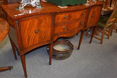 Lot 1274 - A reproduction twin pillar dining table and a matching serpentine fronted sideboard, 164cm by...
