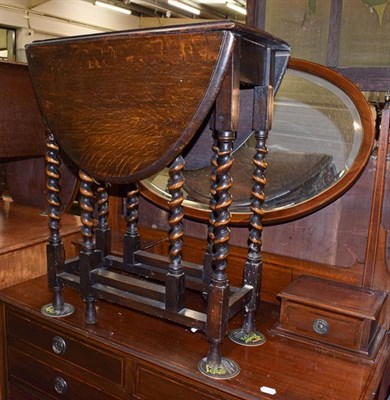 Lot 1286 - An Edwardian inlaid mahogany dressing table, a 1920s oak occasional table, bedside cupboard,...