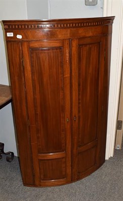 Lot 1288 - A George III mahogany buffet corner cupboard, 77cm by 53cm by 125cm