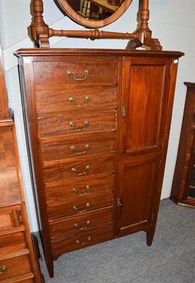 Lot 1293 - A Edwardian mahogany music cabinet, with two cupboards and nine drawers, 84cm by 36cm by 137cm