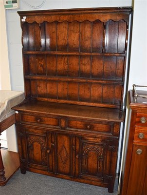 Lot 1297 - A Titchmarsh & Goodwin style oak dresser of small proportions, 107cm by 33cm by 167cm