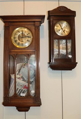 Lot 1298 - An Art Nouveau oak cased chiming wall clock retailed by J W Johnston & Son, Barrow, another...