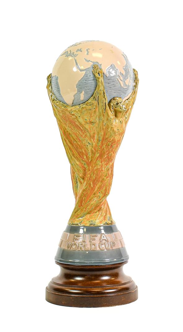 Lot 3006 - Lladro Model Of The Fifa World Cup designed by Bertoni of Italy, raised on turned wooden...