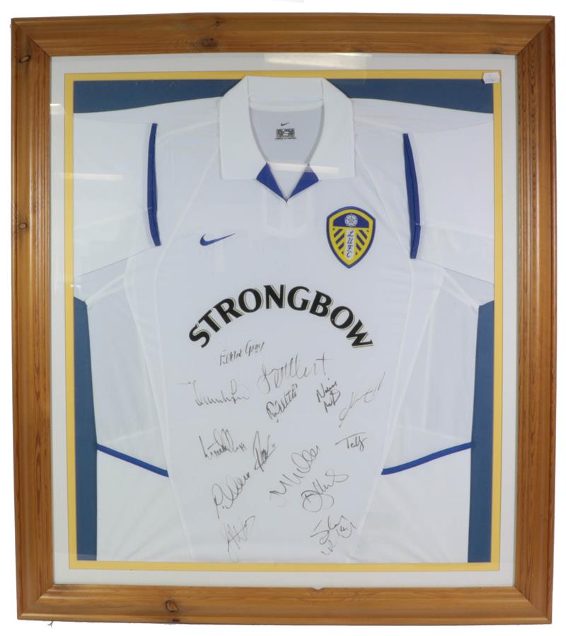 Lot 3022 - Leeds United Football Club Signed Shirt bearing 14 signatures including Eddie Gray, framed with...