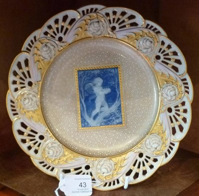 Lot 43 - A Minton Pâte-sur-Pâte Plate, dated 1905, decorated with a winged cherub holding a birthday...