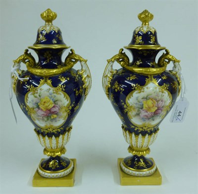 Lot 44 - A Pair of Royal Worcester Porcelain Baluster Vases and Covers, 1901, painted by Harry Chare, with a