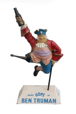 Lot 3182 - Ben Truman Advertising Figure soft plastic pirate holding a bottle aloft on wooden stand 'More Hops
