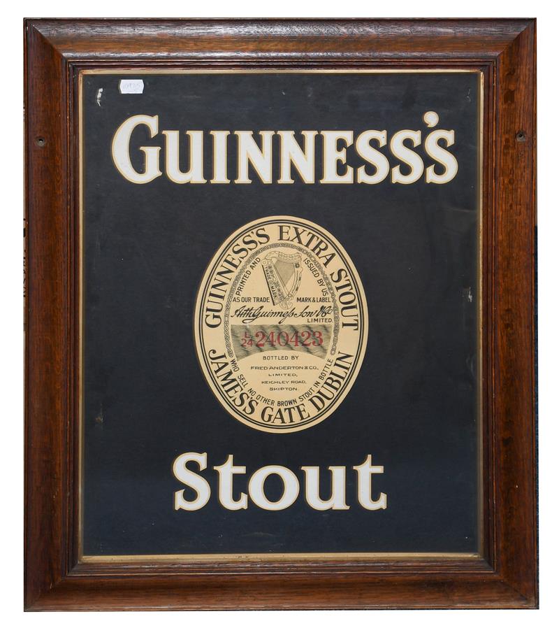 Lot 3184 - Guinness Advertising Poster Guinness Stout and bottle label on black ground, in original frame with