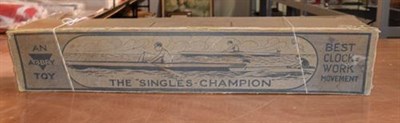 Lot 3258 - Abbey Toys (Made In Germany) The Singles Champion Kayak clockwork with three colour hull and figure