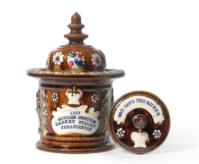 Lot 62 - A Measham Bargeware Tobacco Jar, Cover and Tamper, dated 1887, of cylindrical form with...