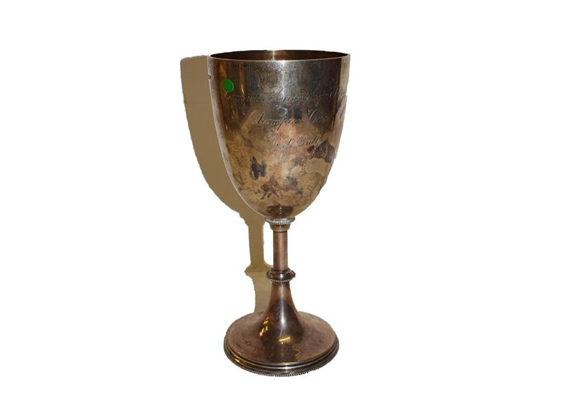 Lot 13 - An Edward VII silver goblet, by Mappin and Webb, Sheffield, 1902, the bowl tapering and...