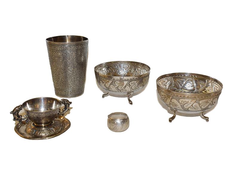 Lot 20 - A collection of assorted silver including an Indian beaker, a Chinese cup and saucer, a pair of...