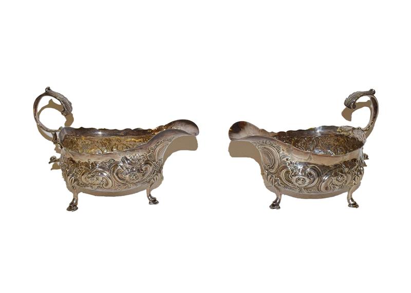 Lot 30 - A pair of George III silver sauceboats, by William Sumner, London, 1785, each on three pad feet and