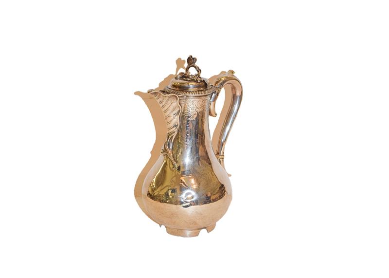 Lot 31 - A George III silver hot water jug, by John Parker and Edward Wakelin,  London, 1761, the handle and