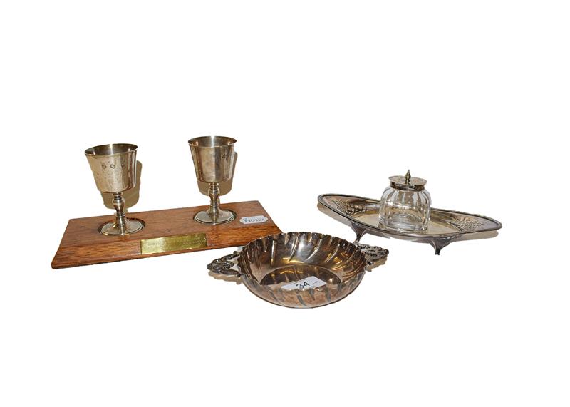 Lot 34 - A collection of silver comprising a pair of Elizabeth II goblets, by Wakely & Wheeler, London,...