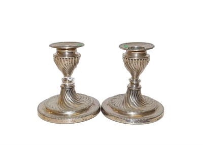 Lot 45 - A pair of Victorian silver candlesticks, by Hawksworth, Eyre and Co, Sheffield, 1899,...