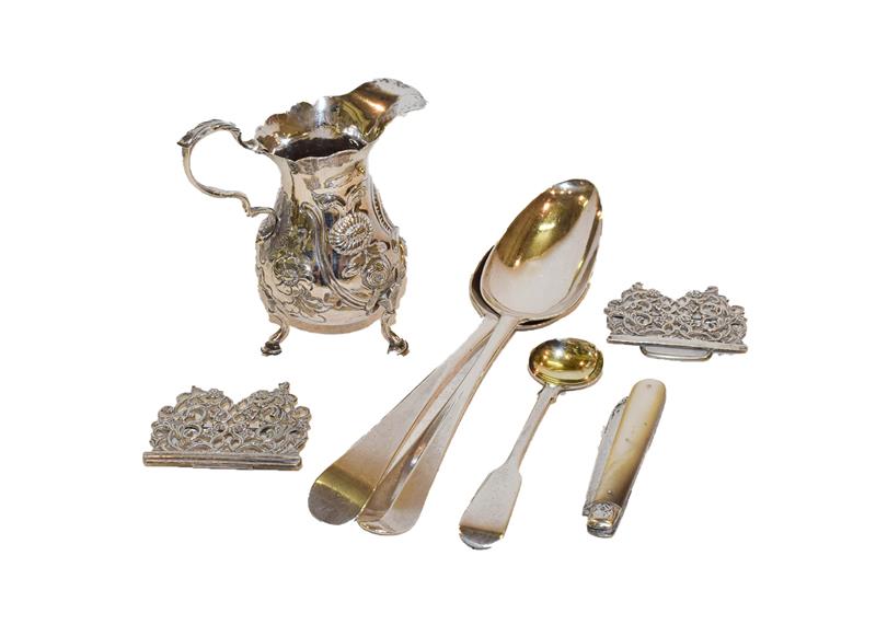 Lot 68 - A collection of silver, including a George II silver cream jug, a nurses belt, a silver and...