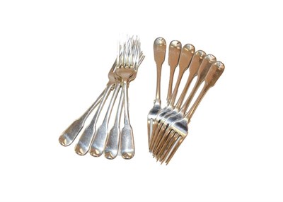 Lot 77 - A set of eleven silver dessert forks decorated in the Fiddle pattern, 14oz 8dwt, 447gr
