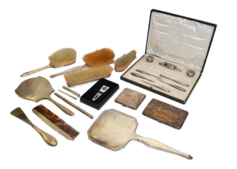 Lot 87 - A collection of assorted silver, including a part dressing table service, two differing...