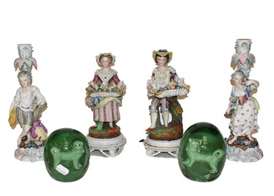 Lot 142 - A pair of German 19th century figural porcelain candle sticks, marks for Johansen Roth, another...