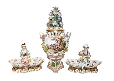 Lot 153 - A pair of 19th century Dresden figural sweetmeat dishes raised on Rococo scroll bases together with