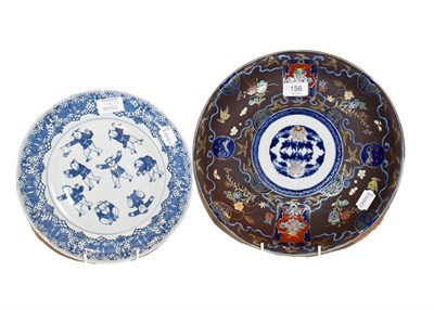 Lot 156 - A Japanese Imari porcelain small charger with cafe au lait ground and a Chinese blue and white...