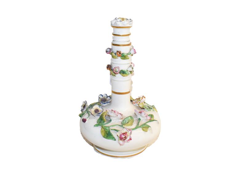 Lot 162 - A Rockingham large porcelain scent bottle, with flower head stopper and decorated with applied...